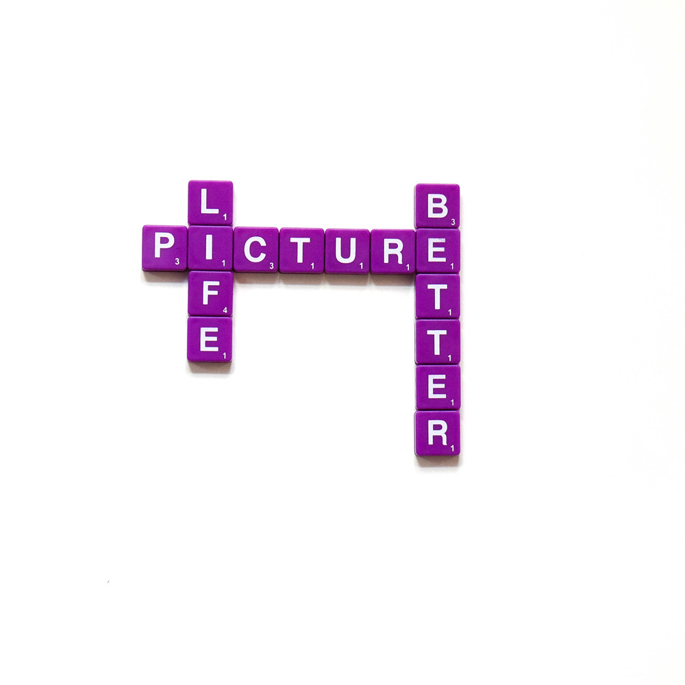 Scrabble letters spell Picture Life Better